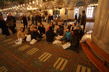 Many many tourists inside the Blue Mosque